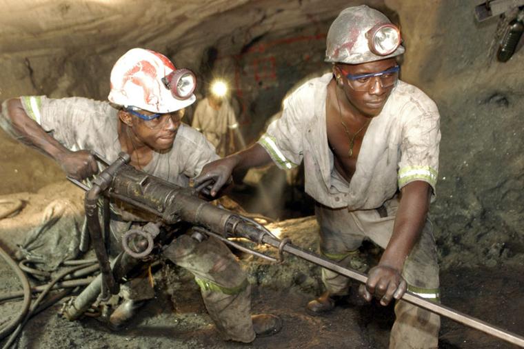 Workers at the TanzaniteOne mine drilling for tanzanite.