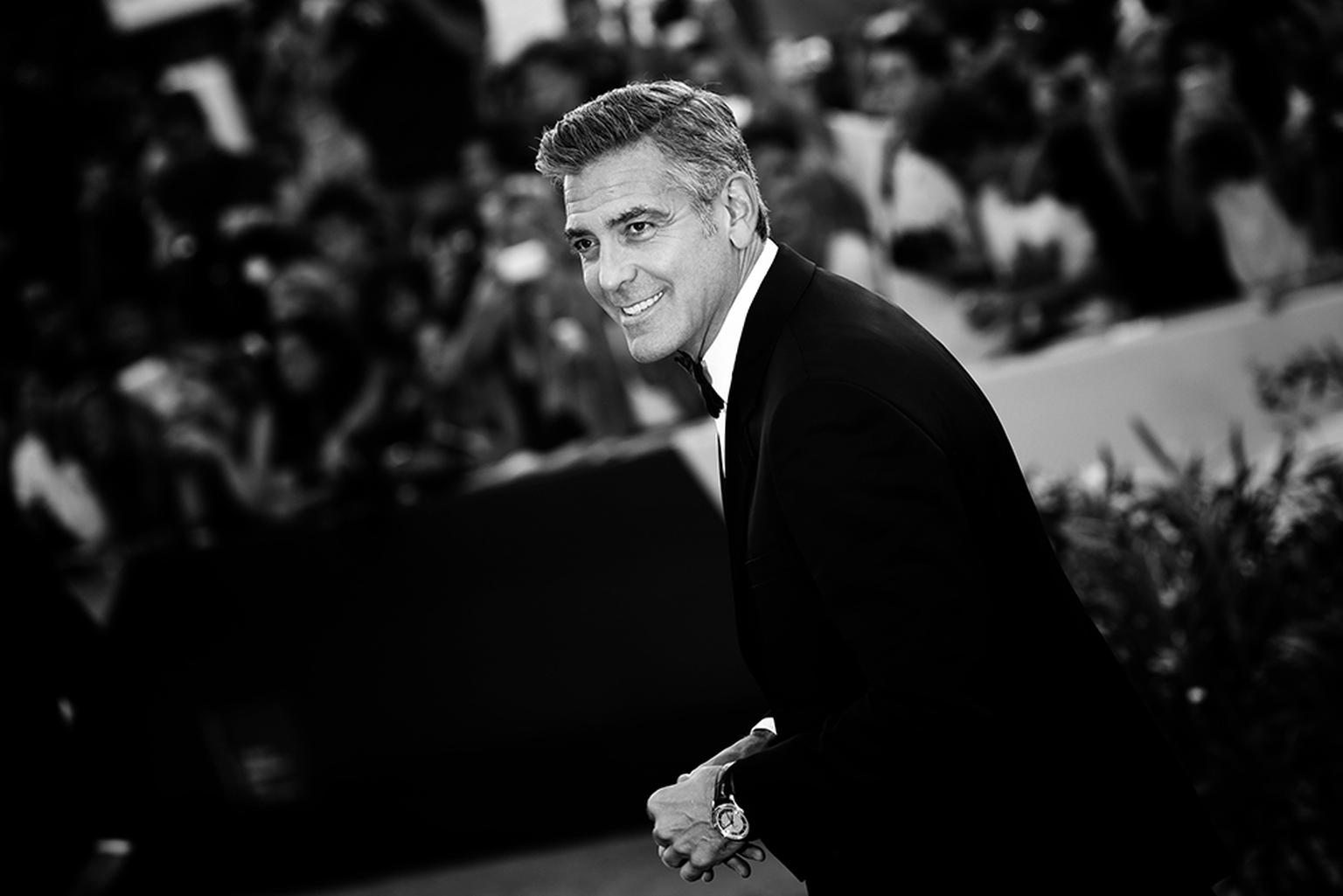 Omega ambassador George Clooney, pictured wearing an Omega De Ville Hour Vision watch at the Venice Film Festival 2013, married Amal Alamuddin this weekend in Venice wearing an Omega De Ville Trésor watch.