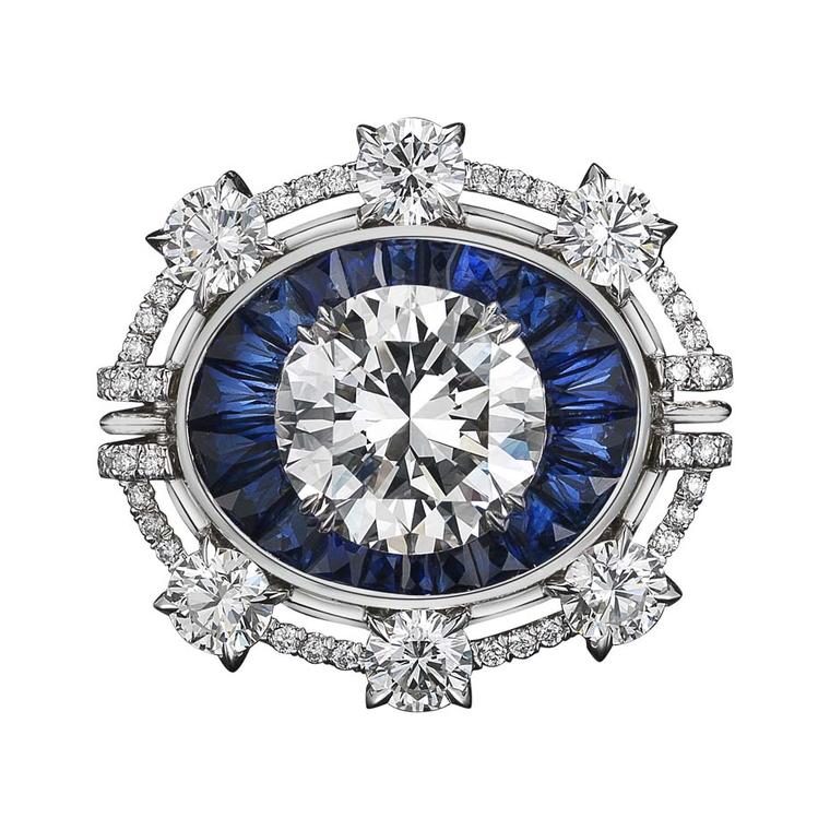 One-of-a-kind Alexandra Mor ring features 22 blue sapphire trapezoids and a 4.02ct brilliant-cut diamond, surrounded by six round diamonds set in platinum on yellow gold.