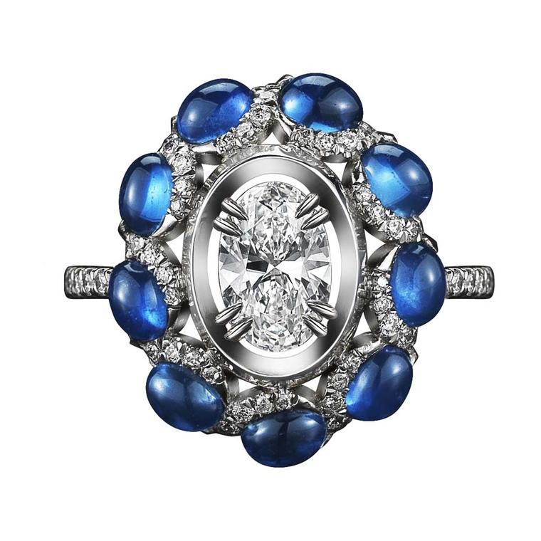 Alexandra Mor one-of-a-kind platinum ring featuring nine blue oval-cut sapphire cabochons and an oval-cut floating diamond.