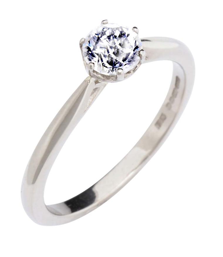 CRED's solitaire diamond engagement ring features a basket setting in Fairtrade gold.