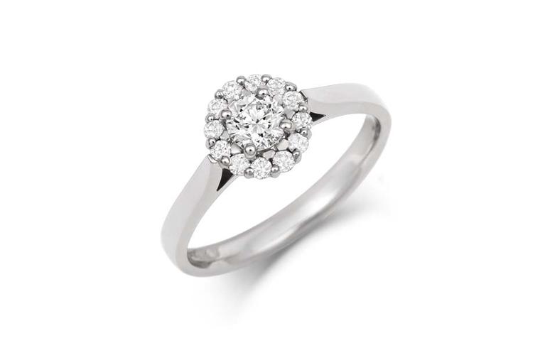 This Halo Cluster diamond engagement ring by CRED is available in yellow or white Fairtrade gold or from 100% recycled platinum.