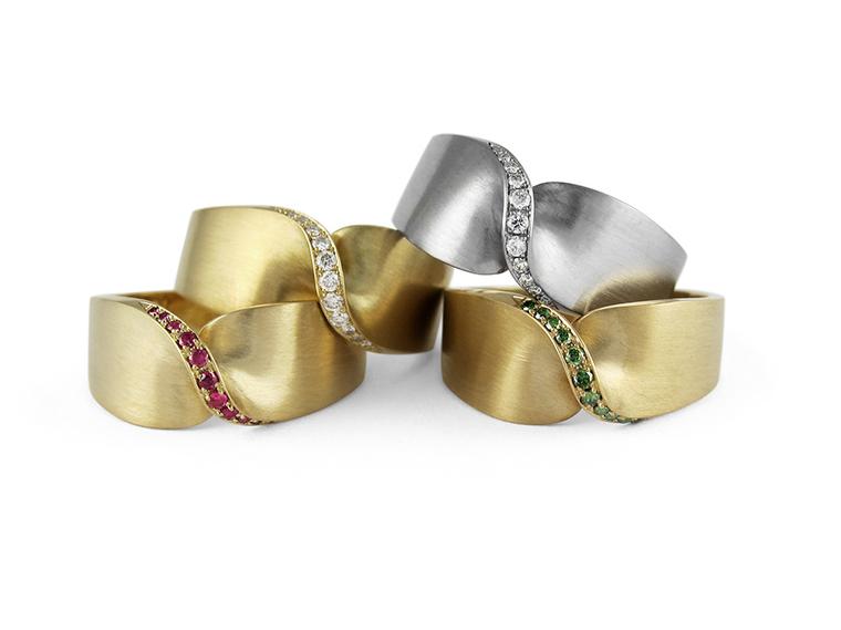 Wedding band designs from Jessica Poole in Fairtrade white and yellow gold, set with pavé diamond, rubies and emeralds.