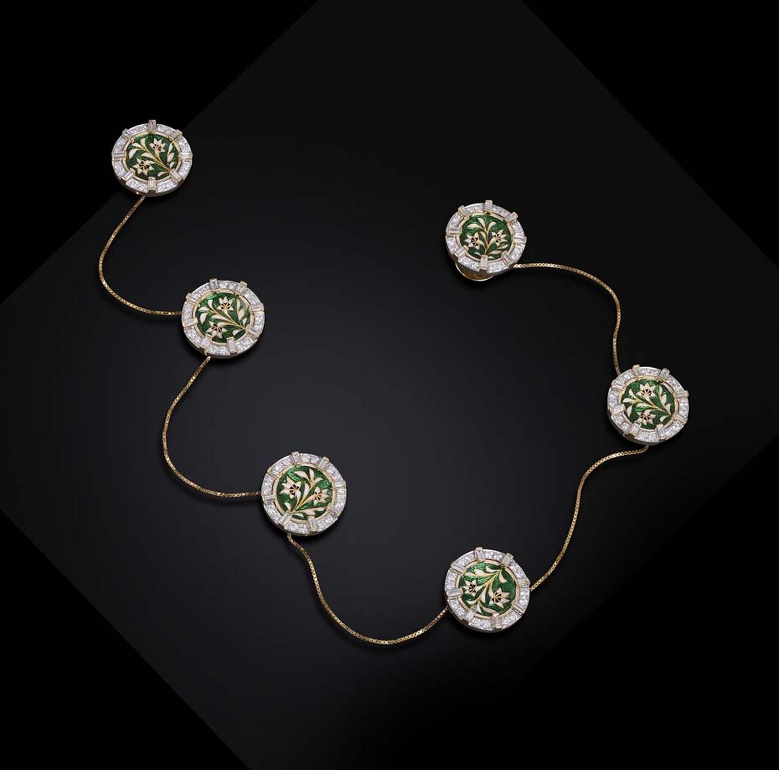 Farah Khan's diamond kurta buttons with rich green and white floral enamel are attached by gold chains.