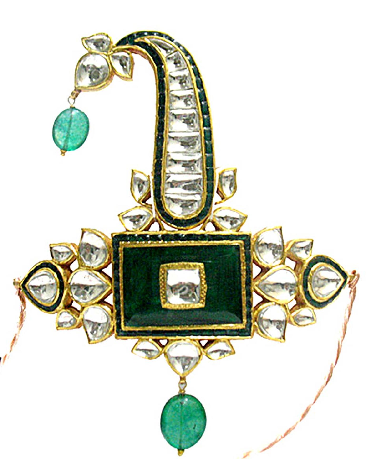 An emerald and uncut diamond sarpech by Sunita Shekhwat.