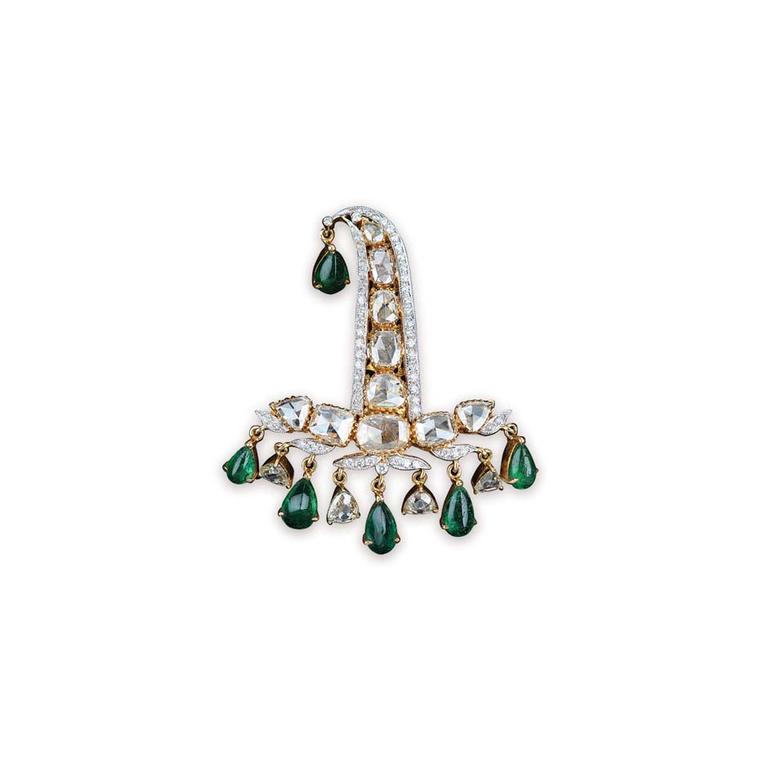 Golecha's emerald brooch featuring uncut diamond and kalgi.