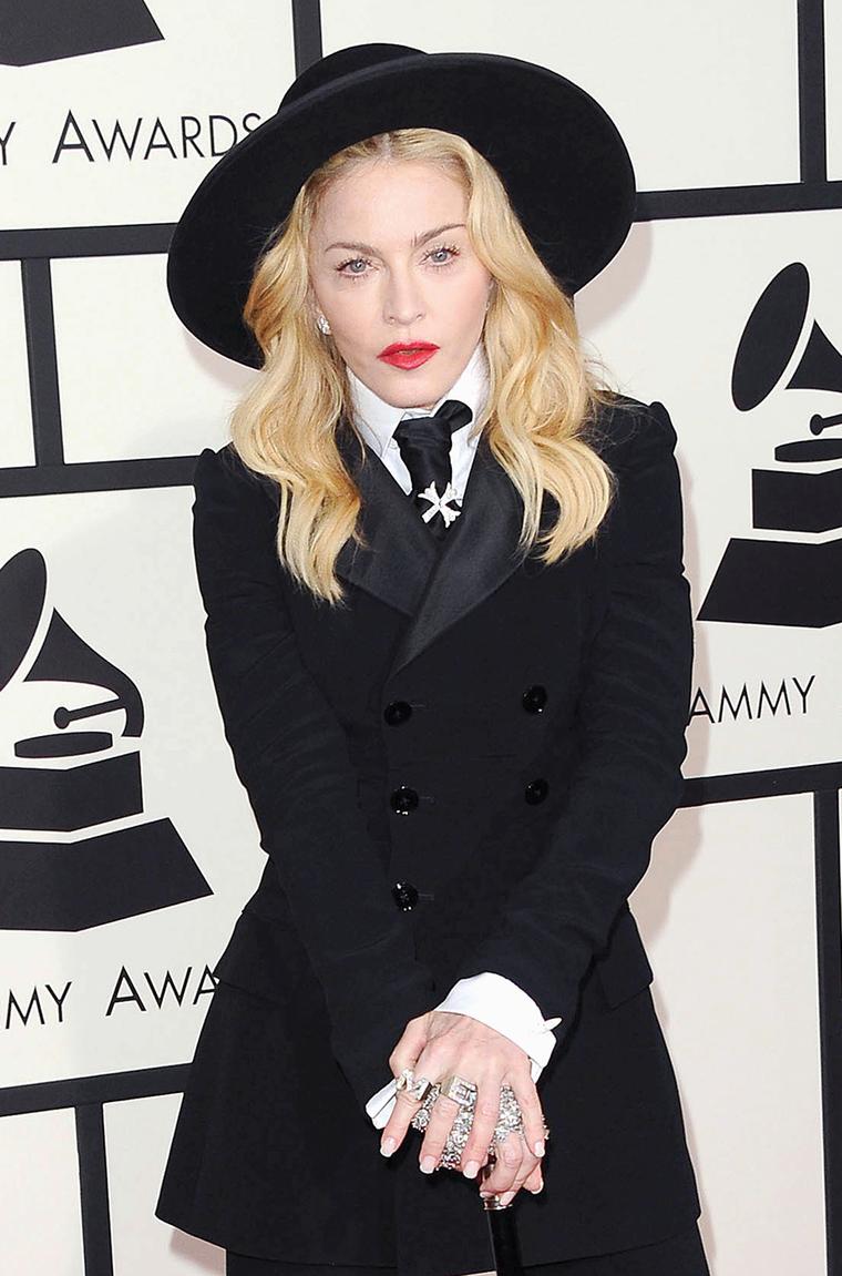 Madonna caused a stir at the Grammy Awards 2014 wearing diamond initial "M" and "E" rings by Neil Lane