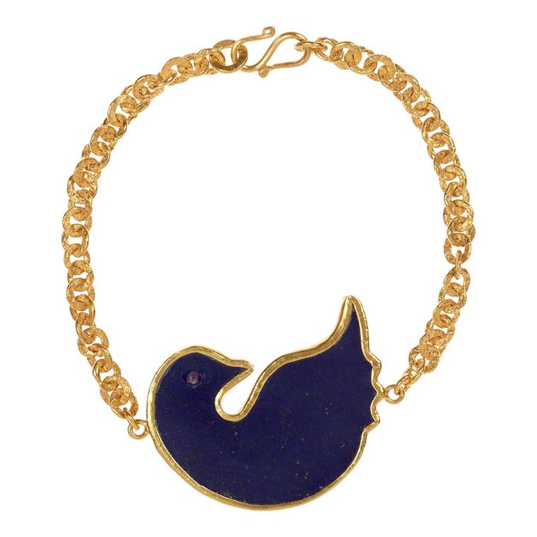 Pippa Small's gold Turquoise Mountain bracelet includes a dove of peace in lapis lazuli.