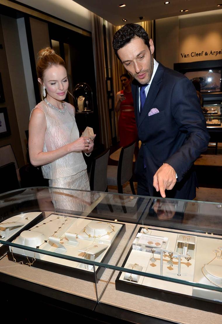 Kate Bosworth peruses some of the jewels on display alongside Alain Bernard, president and CEO of Van Cleef & Arpels, The Americas