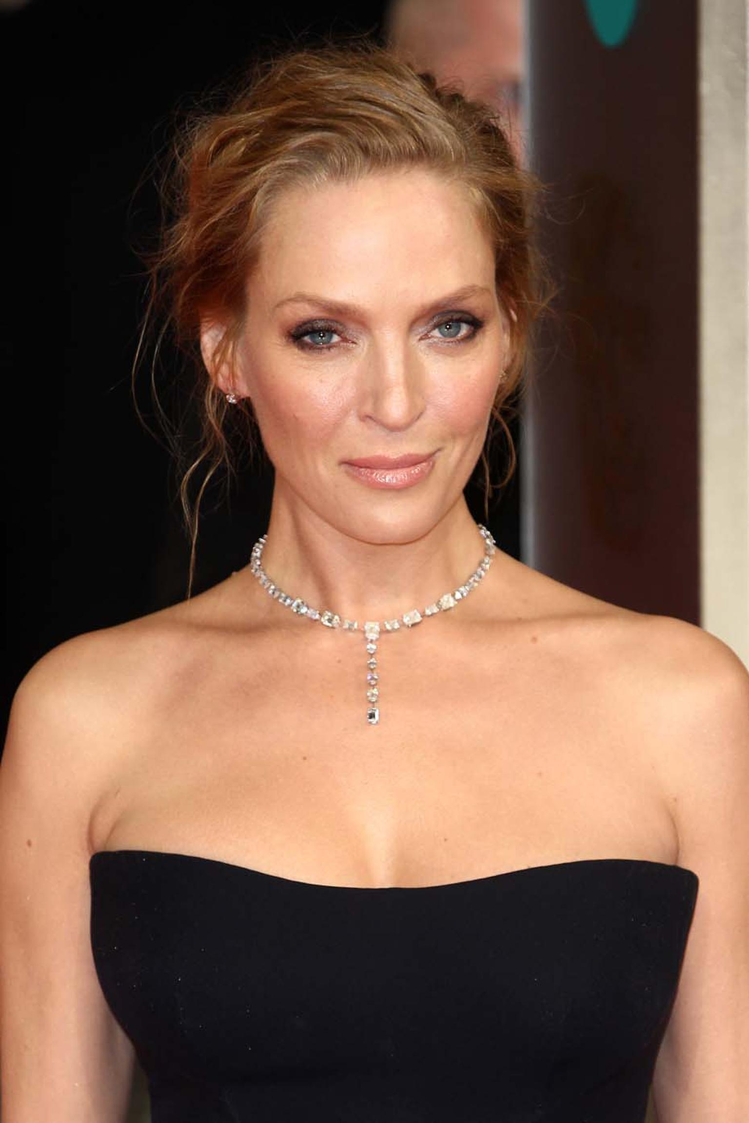 BAFTAs 2014 presenter Uma Thurman wore a necklace by Chopard featuring 32ct of diamonds, diamond stud earrings, a heart-shaped diamond bracelet and a ring from the Chopard Temptations collection