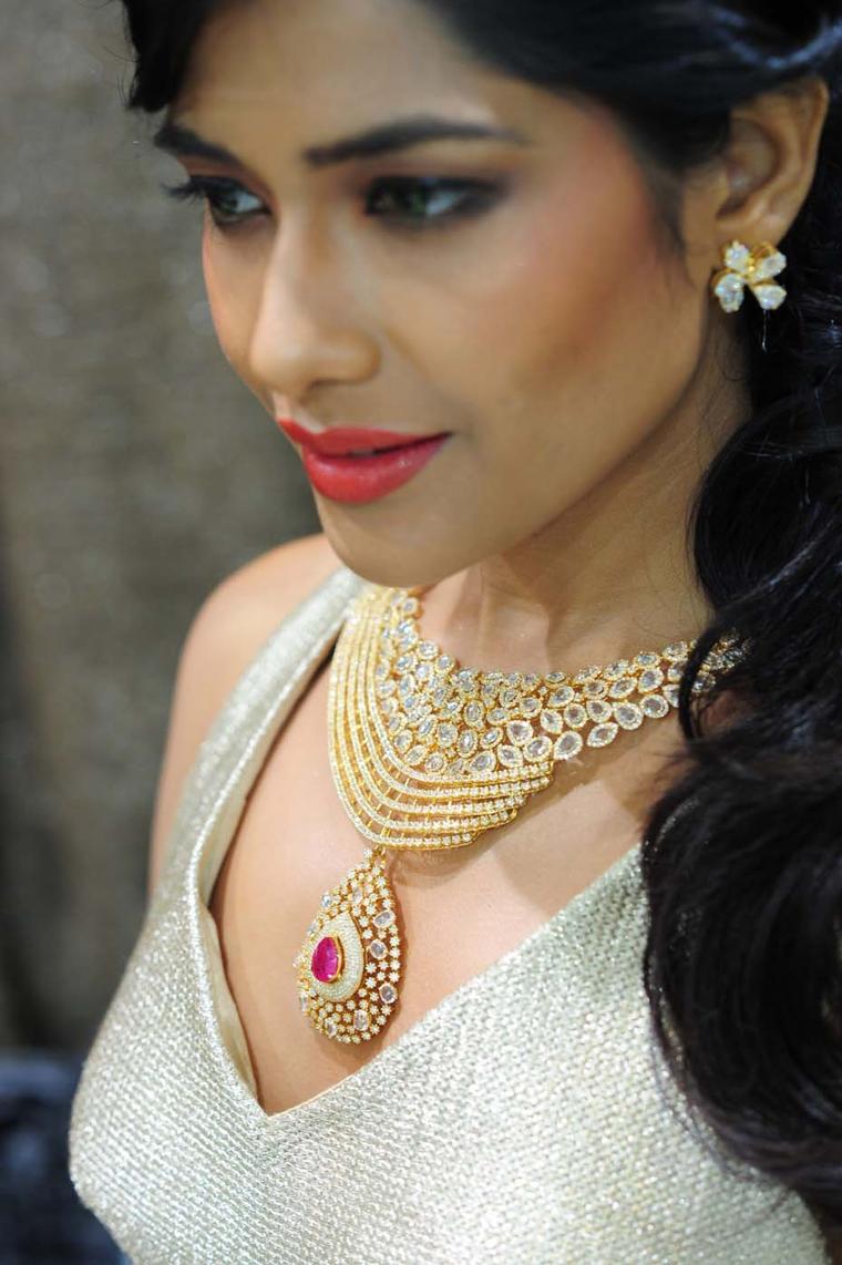Varuna D Jani yellow gold necklace featuring diamonds and a central ruby