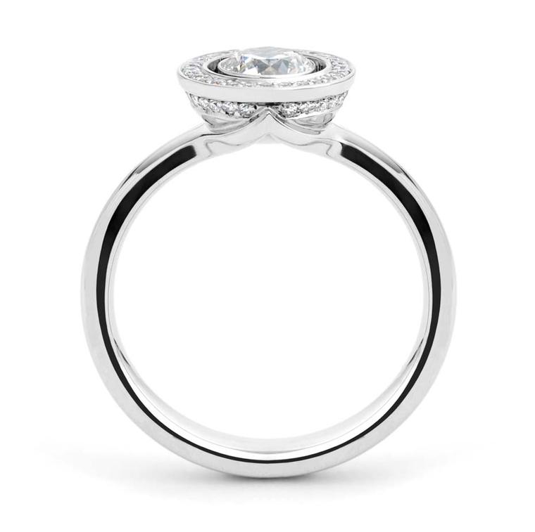 Andrew Geoghegan Lacuna white gold engagement ring featuring brilliant-cut diamond surrounding  a centre stone.