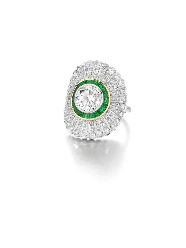 Jessica McCormack yellow and white gold Emerald Daisy ring set with a 1.80ct brilliant-cut diamond surrounded by hand-cut calibrated emeralds