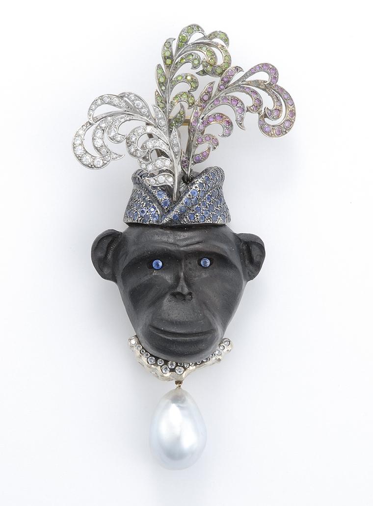 Sorab & Roshi Royal Monkey pin in ebony wood with pavé white, green and pink diamond feather hat and a sapphire and South Sea pearl drop