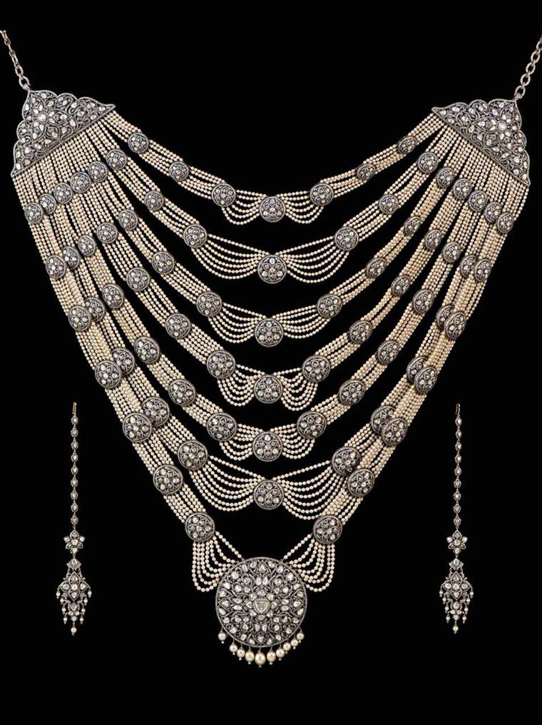 Necklace and earrings from a Munnu Kasliwal wedding suite in gold, featuring silver, diamonds and pearls