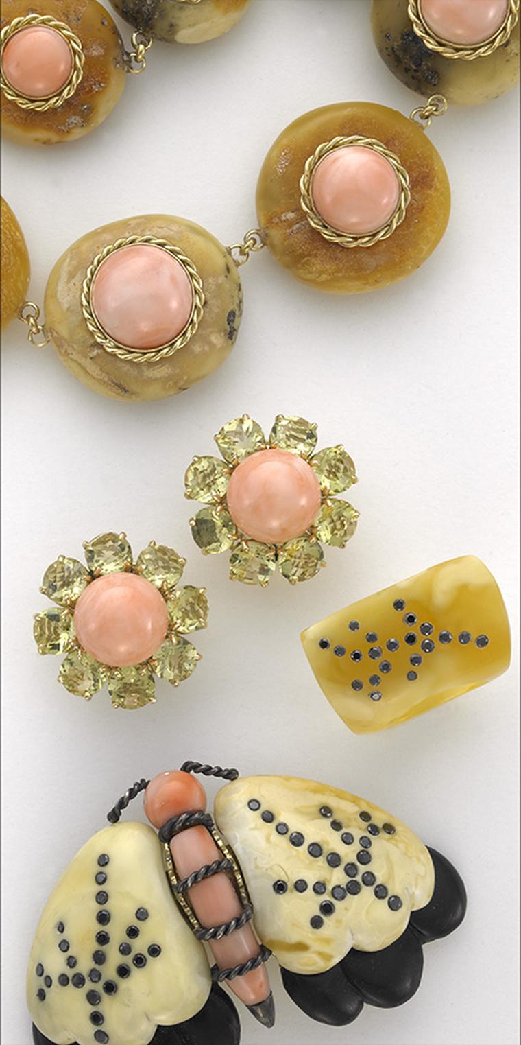 Sorab & Roshi butterscotch amber and pink coral Donut necklace in gold, Daisy flower earrings with lemon citrine & pink coral, butterscotch amber ring with black diamonds and butterscotch amber Moth pin with ebony wood, pink coral and black diamonds