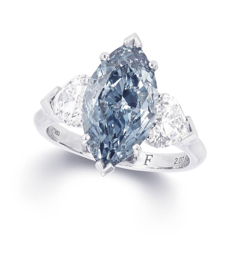 Graff marquise-cut blue centre diamond ring featuring two white diamonds.