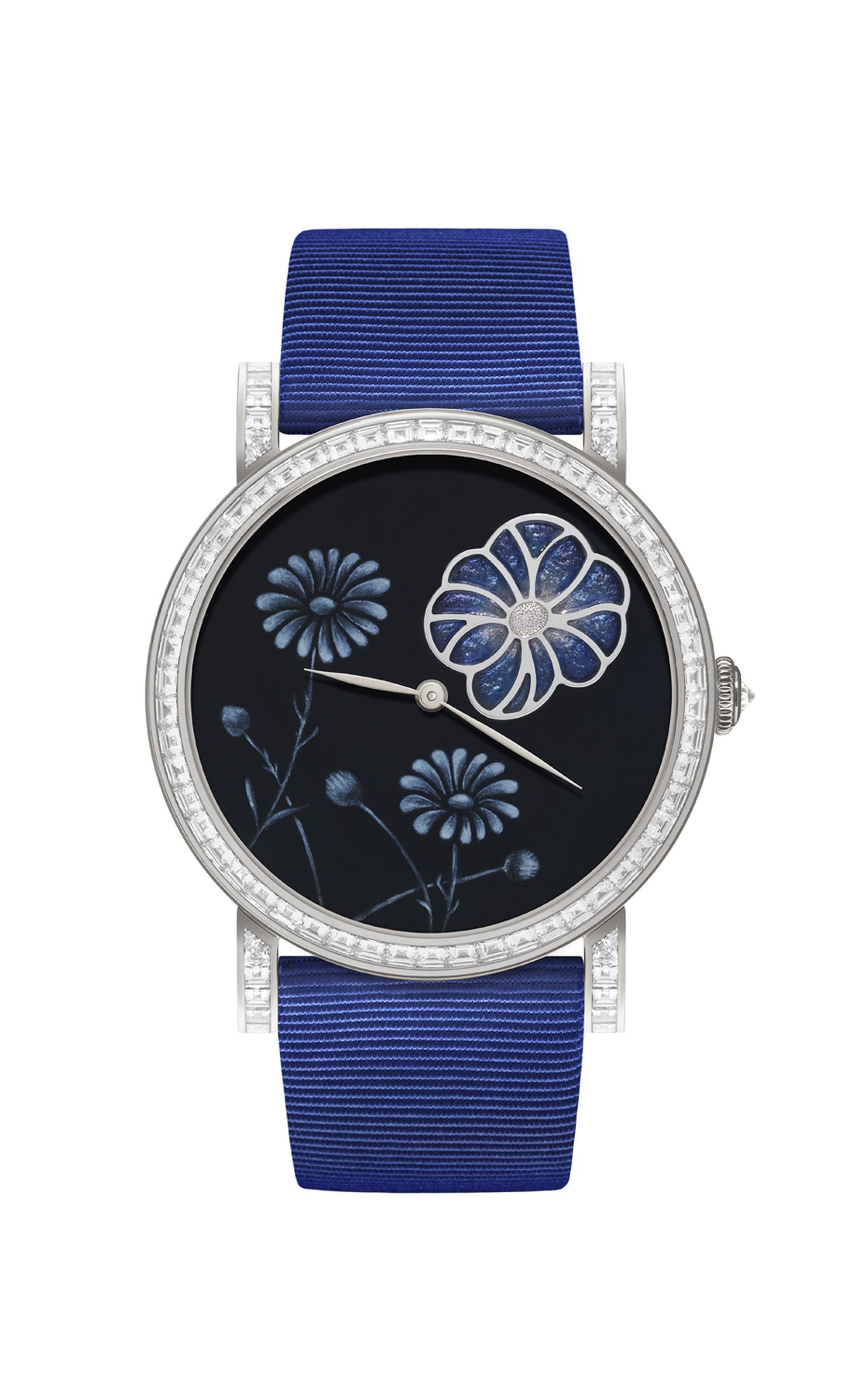 DeLaneau Daisy plique a jour watch features an intricate Grand Feu enamel dial and a white gold case set with 74 baguette-cut diamonds and 116 brilliant-cut diamonds, with a diamond-embedded crown.