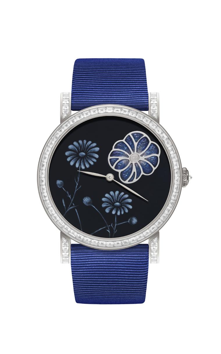 DeLaneau Daisy plique a jour watch features an intricate Grand Feu enamel dial and a white gold case set with 74 baguette-cut diamonds and 116 brilliant-cut diamonds, with a diamond-embedded crown.
