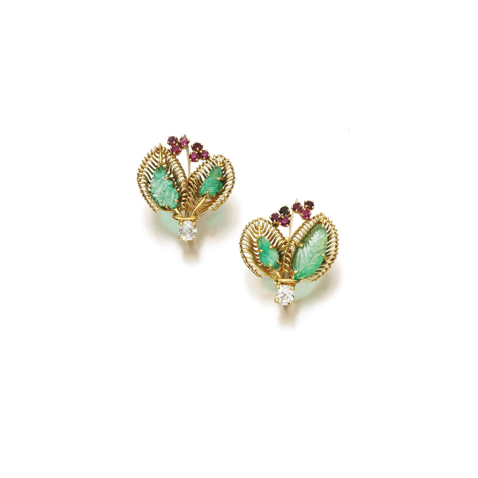 Lot 103, from the Daisy Fellowes collection, a pair of 1950s ruby, emerald and diamond earrings featuring a stylised bouquet design, each set with two foliate carved emeralds, circular-cut rubies and diamonds (estimate: £3,000-5,000; unsold)