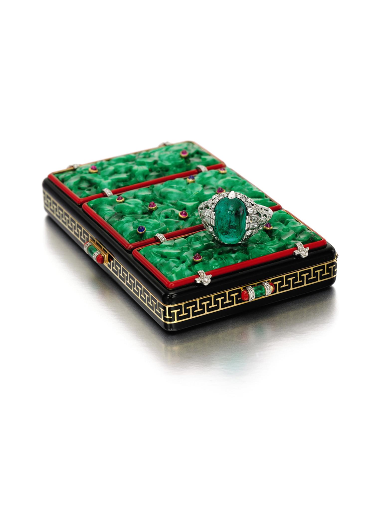 Lot 282, Lacloche Frères 1920s gem set, enamel and diamond vanity case, set with three carved jadeite plaques inset with cabochon sapphires and rubies up for auction at Sotheby's London. (estimate: £ 8,000-12,000).