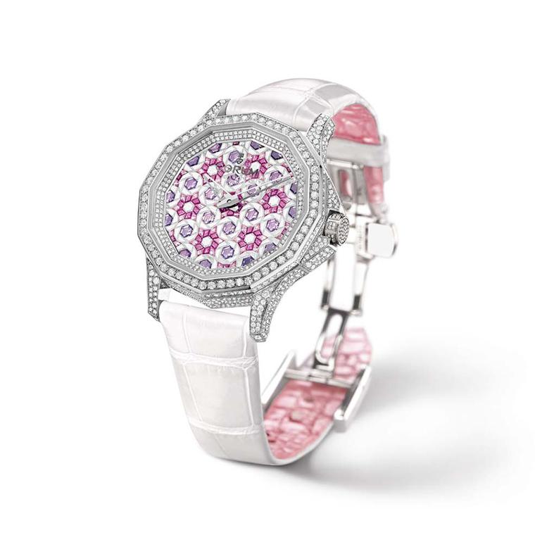 Corum 12-sided Admiral's Cup Legend 38 for women is adorned with diamonds and pink and purple sapphires, set to create a tightly packed geometric floral motif
