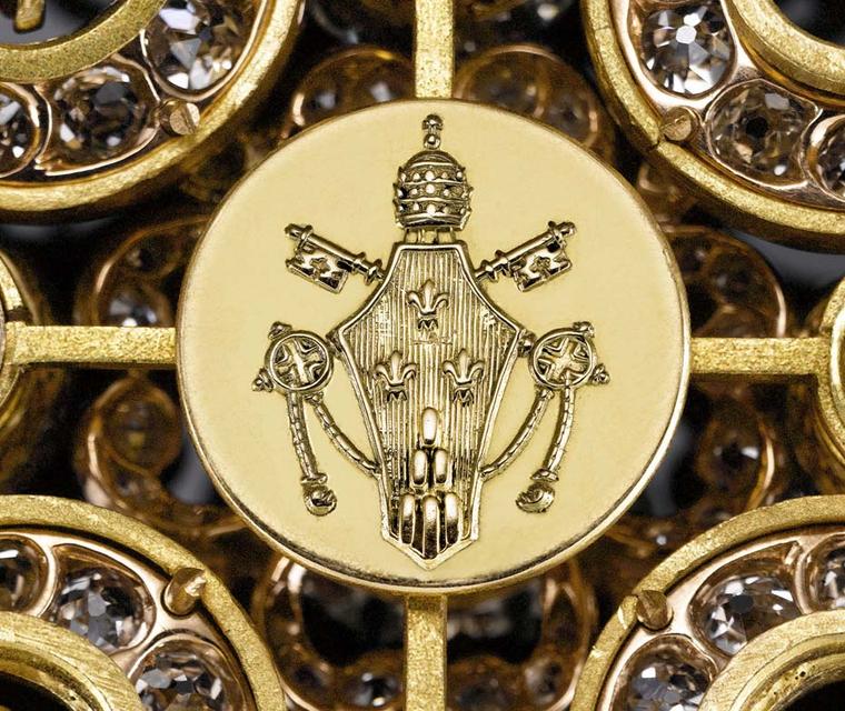 The engraving found on the diamond cross is the Christian Chi Ro symbol, indicating that it was most likely created by Vatican jewellers.