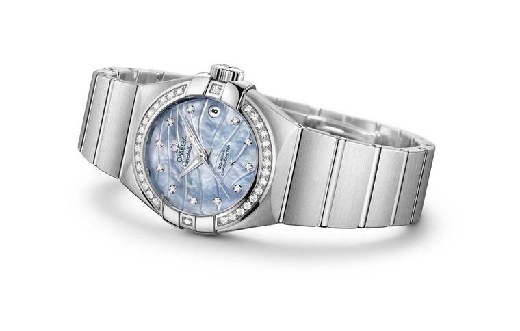 The stainless steel Omega Constellation Pluma features a blue mother-of-pearl engraved dial set with diamonds.