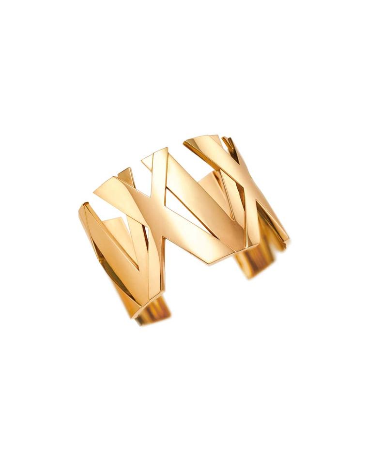 Tiffany & Co. Atlas II collection yellow gold wide bangle featuring a weave of roman numerals.