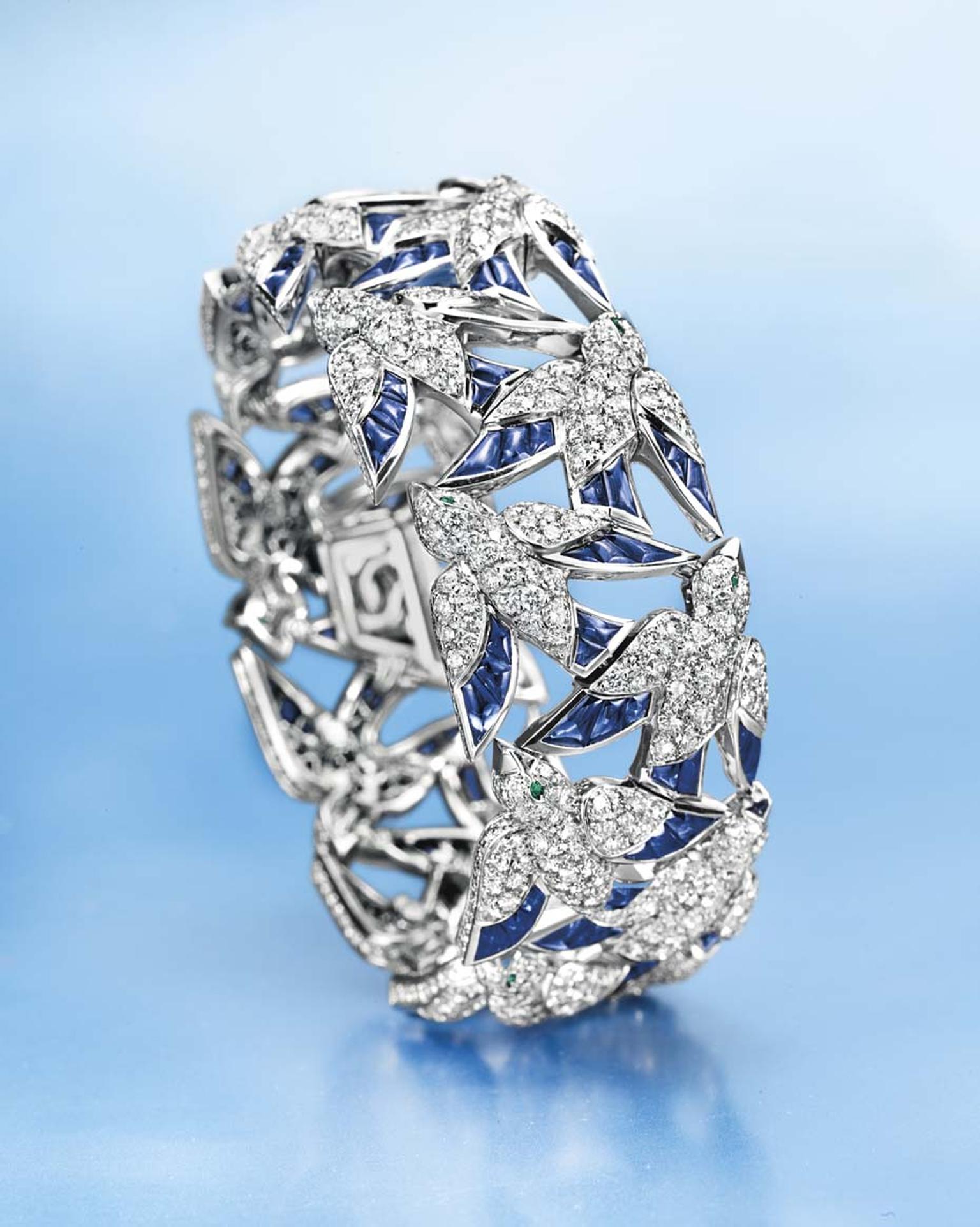Lot 102, a diamond, sapphire and emerald "En Vole" bracelet by Cartier, designed as a series of circular-cut diamond birds (estimate: US$60-80,000)