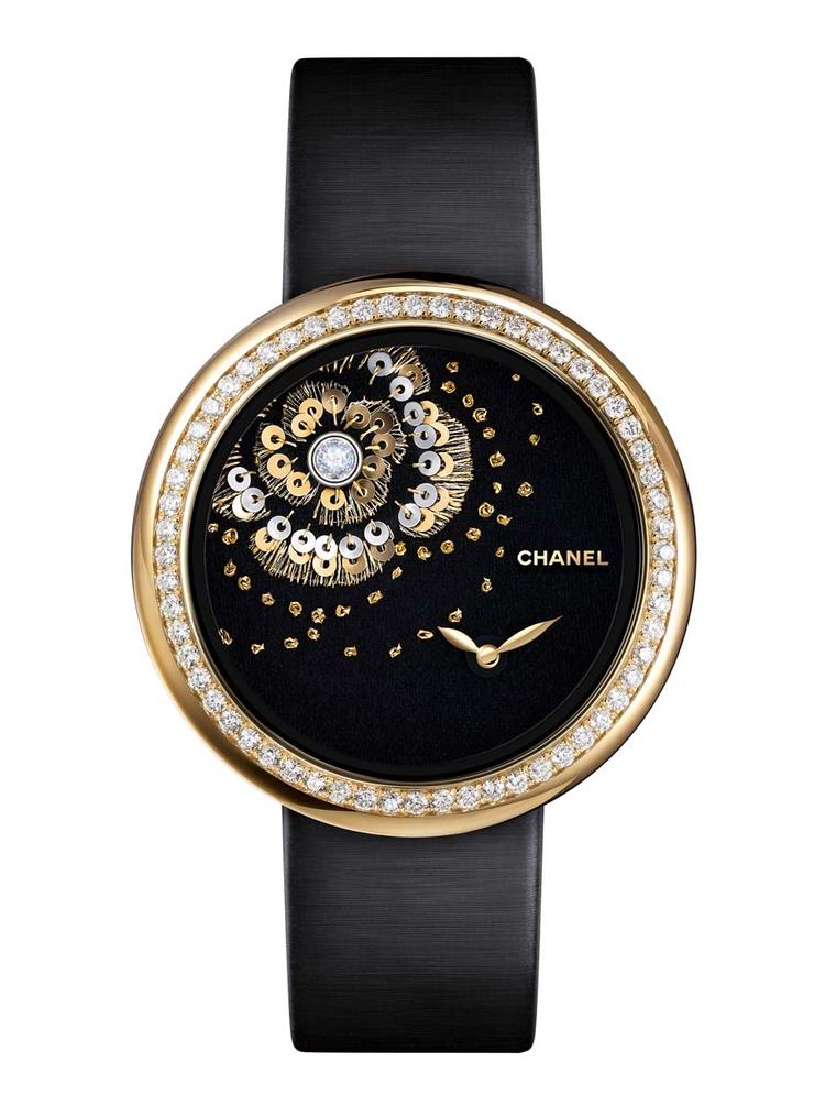 The new Chanel Mademoiselle Privé Camellia Brodé Lesage watch is hand embroidered with gold and green silk thread, white and yellow gold sequins and knotted camellia flowers, and set with a single rose-cut diamond on the dial
