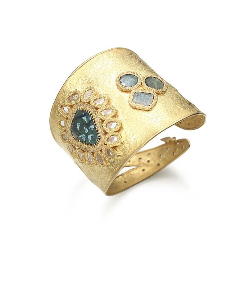 Coomi gold cuff with blue diamonds.