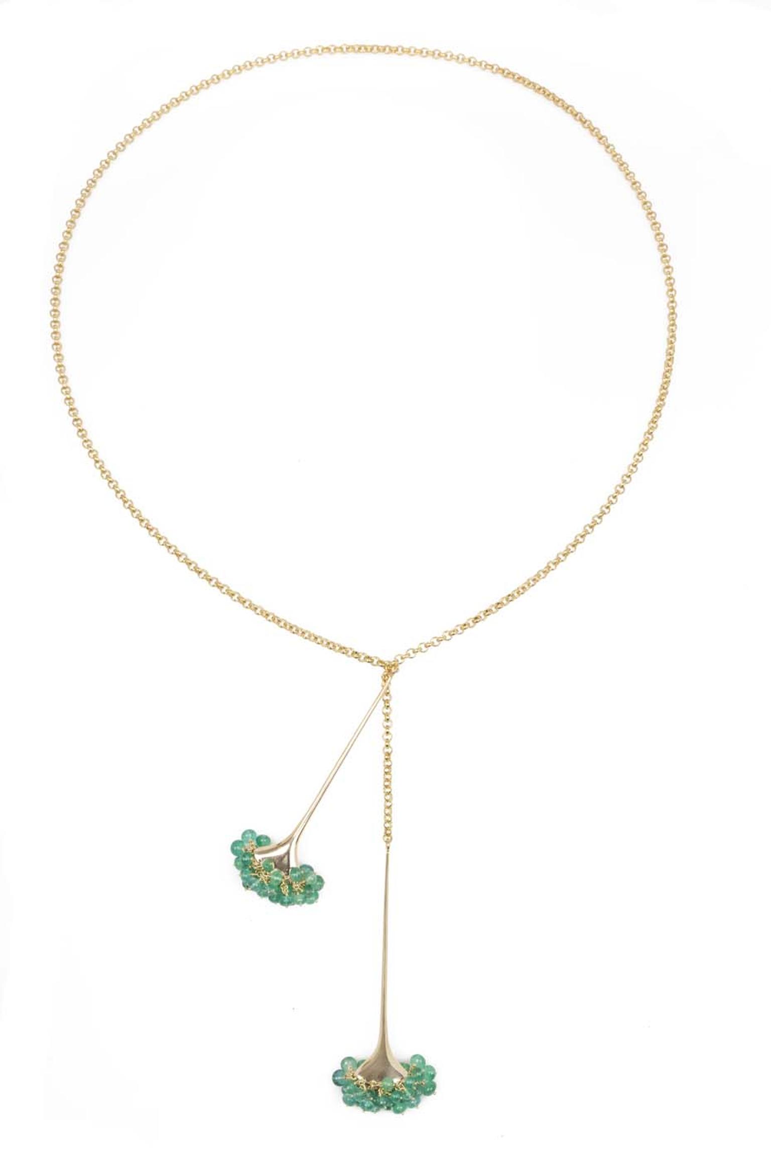 Gurmit Campbell gold Toga necklace featuring emerald beads.
