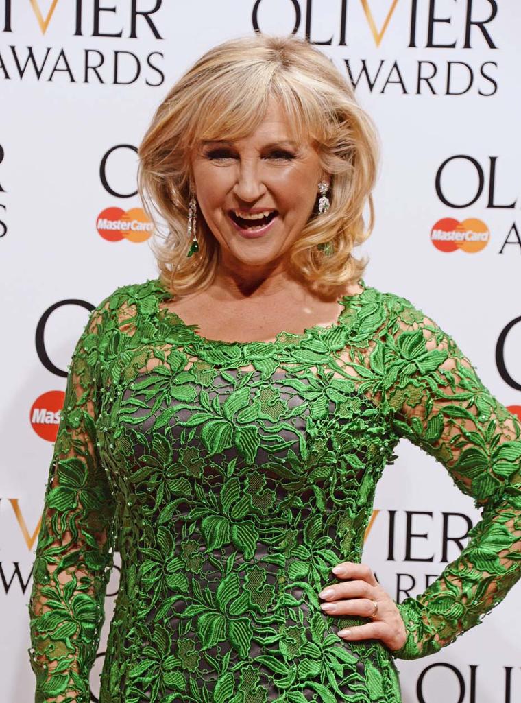 Opera singer and presenter Lesley Garrett wore David Morris' Art Deco style diamond and emerald drop earrings.