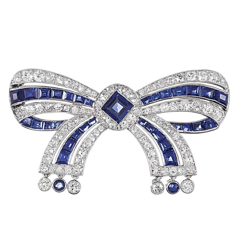 Cartier Important Early Art Deco Sapphire Diamond Bow Pin ($45,000), available at 1stdibs.com. Image by: ScullyFoto.com