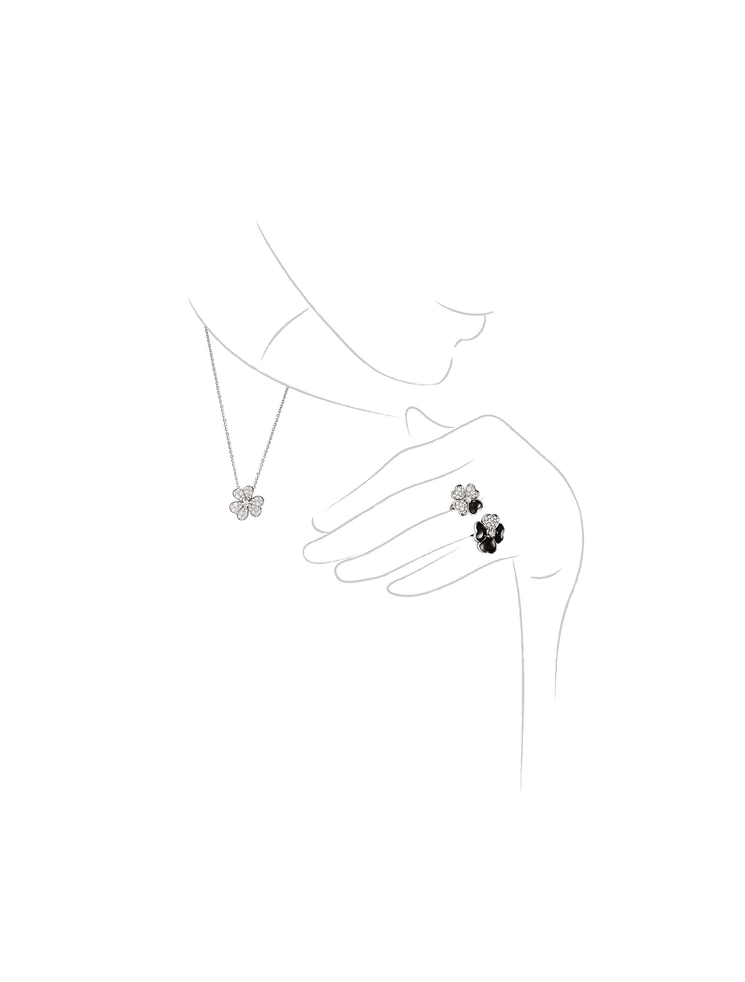 Van Cleef & Arpels Cosmos Between the Finger onyx and diamond ring and Cosmos diamond necklace.