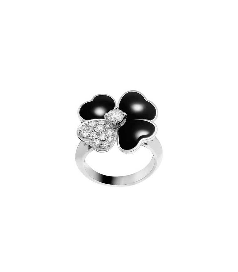 Van Cleef & Arpels Cosmos ring in white gold with a brilliant-cut diamond bud surrounded by onyx and diamond petals
