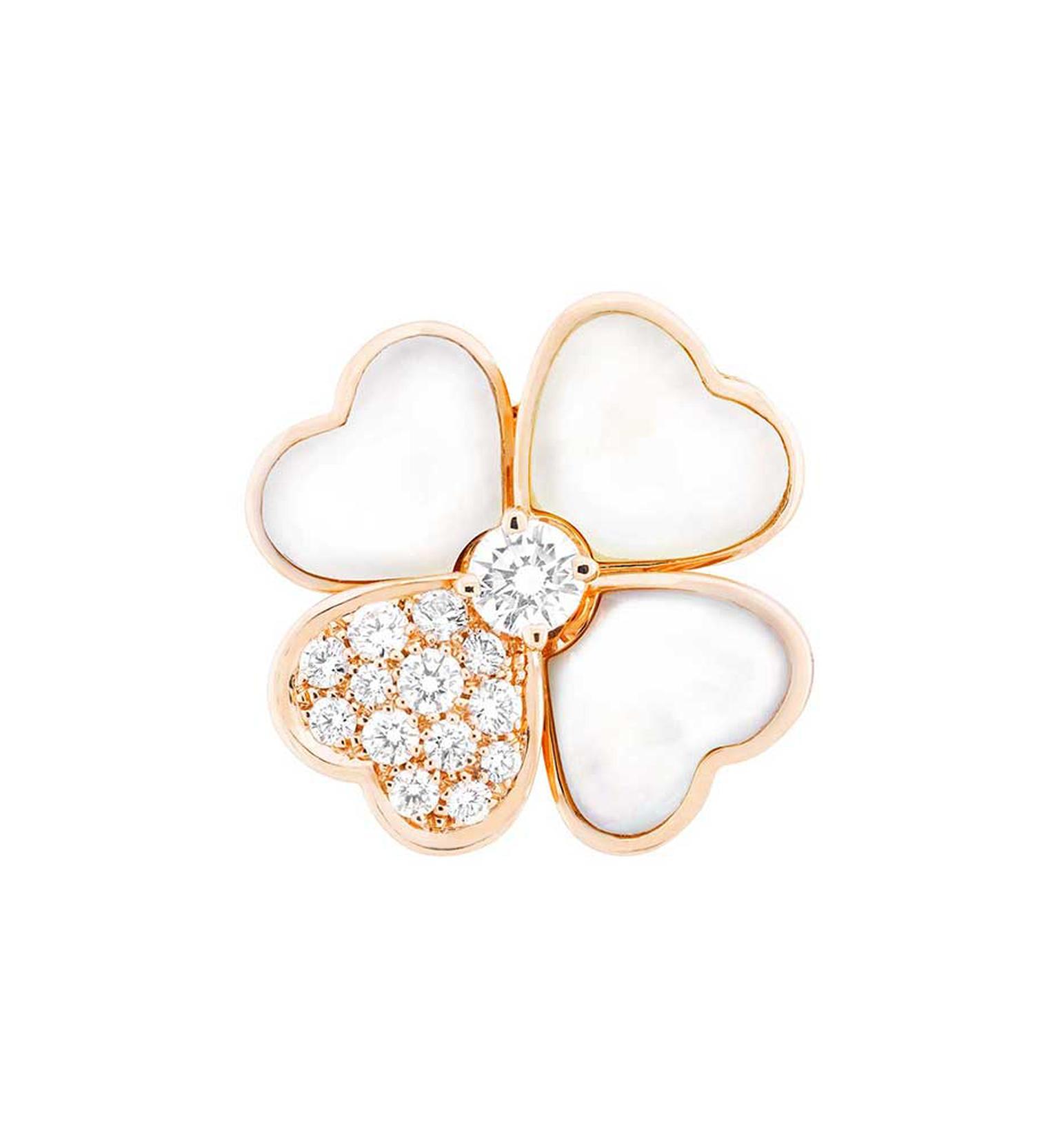 Van Cleef & Arpels' new Cosmos pendant in rose gold, with a brilliant-cut diamond bud surrounded by white mother-of-pearl and diamond petals, can also be worn as a clip