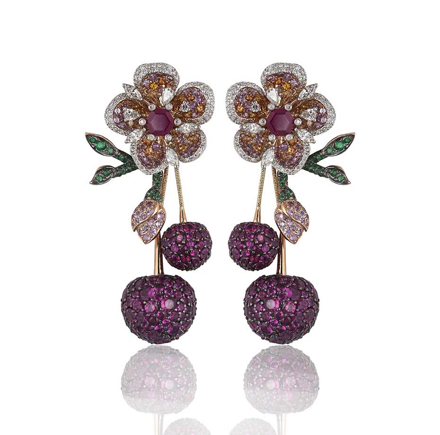 Lot 6, a pair of Gemfields Mozambican ruby, Gemfields Zambian emerald, diamond, pink sapphire and orange sapphire earrings by Mirari, being auctioned as part of a suite (estimate: INR 3,600,000 - 4,350,000; $60,000 - 73,000)