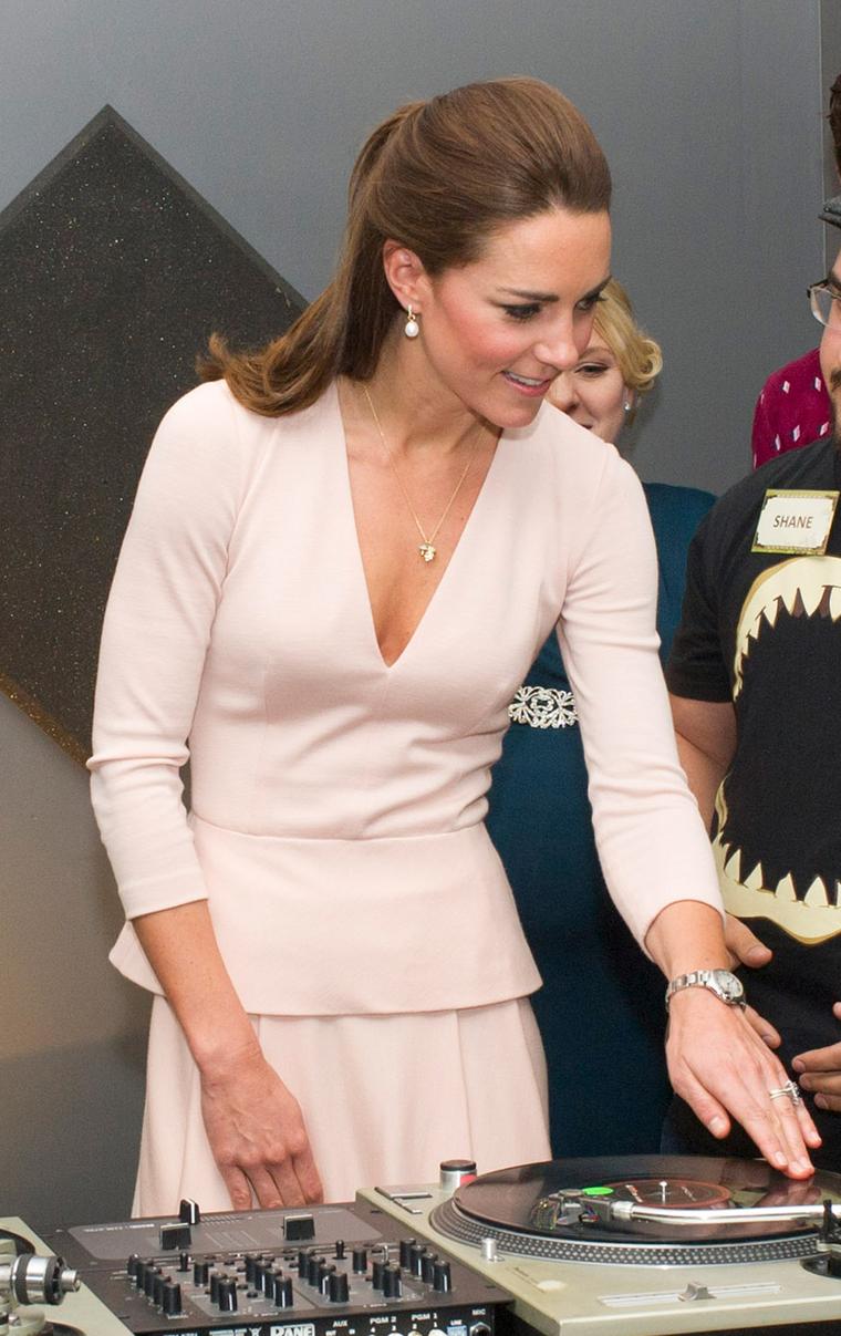 Kate Middleton staying true to her British roots in an Asprey charm necklace and Annoushka pearl earrings during the Royal Tour