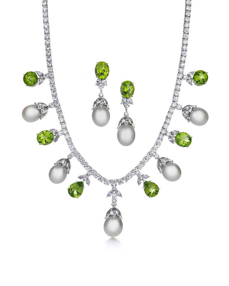 Tiffany & Co. Triple Strand platinum necklace and earrings featuring white South Sea pearls, bright green peridots and diamonds
