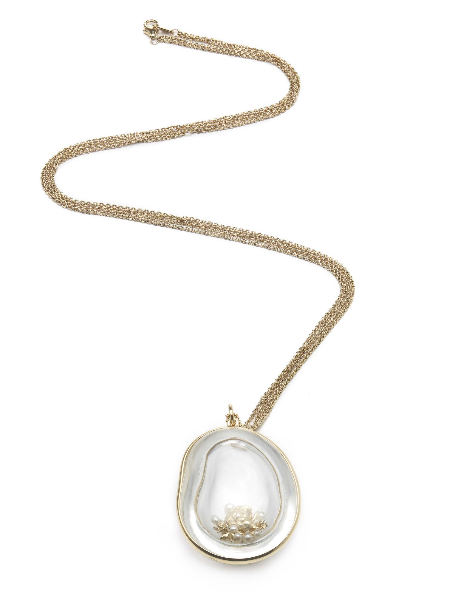 Bibi van der Velden Memorabilia necklace with a hollow bean, carved out of rock crystal, filled with pearls, gold stars and diamonds (€5,495)