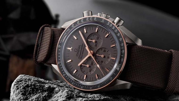 The new Omega Speedmaster Apollo 11 45th Anniversary watch features a dark-grey grade-2 titanium case, Sedna rose gold tachymeter bezel, laser-treated brown dial and a high-quality brown NATO strap