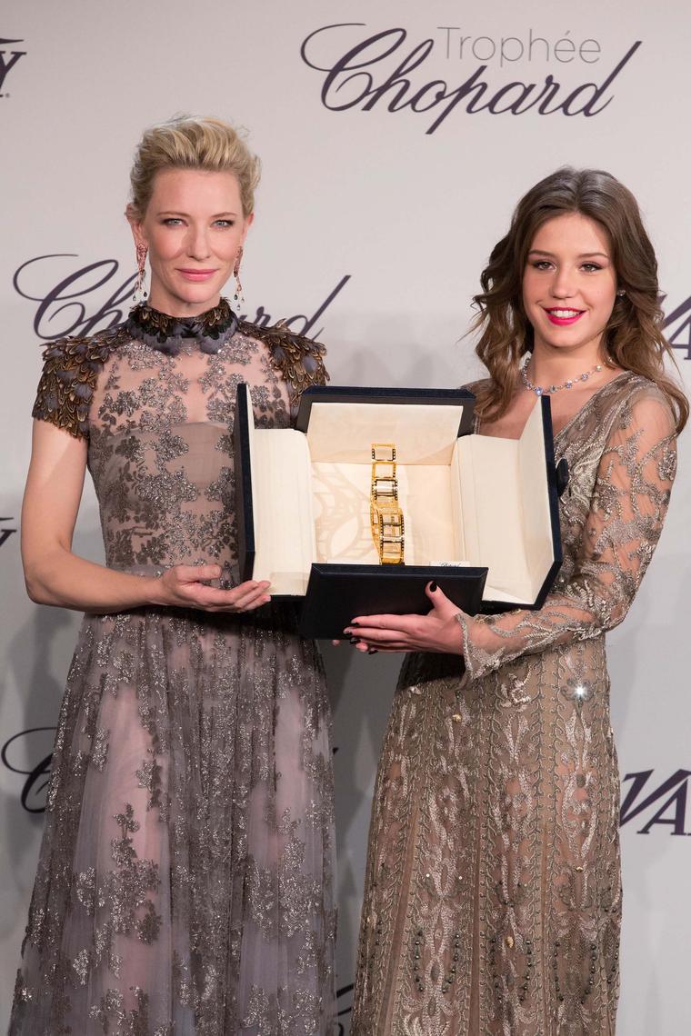 Cate Blanchett, patroness of the Trophée Chopard 2014, presents Adèle Exarchopoulos with her respective prize wearing one-of-a-kind shrimp earrings and a snail bracelet from Chopard's Animal World collection