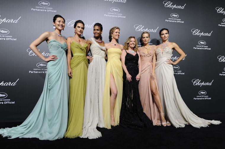 Supermodels Liu Wen, Alessandra Ambrosio, Arlenis Sosa, Eva Herzigova, Petra Nemcova and Adriana Lima lined up either side of Caroline Scheufele, co president of Chopard - dressed in black - at the Swiss jeweller's exclusive Backstage party wearing Elie S