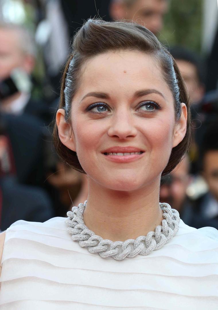Marion Cotillard looked impossibly pretty in a pleated Dior dress teamed with Chopard jewellery at the Cannes Film Festival 2014.