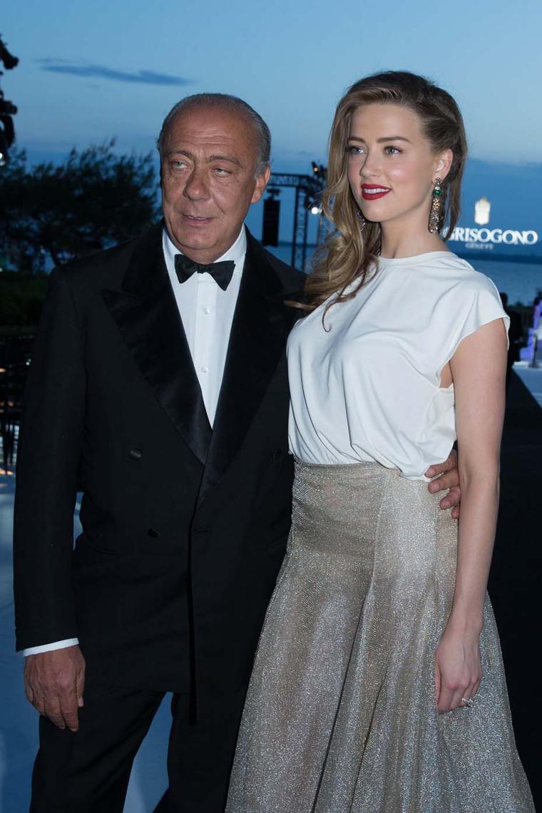 Amber Heard poses with de GRISIGONO founder Fawaz Gruosi during the Swiss jeweller's party at the Hôtel du Cap-Eden-Roc