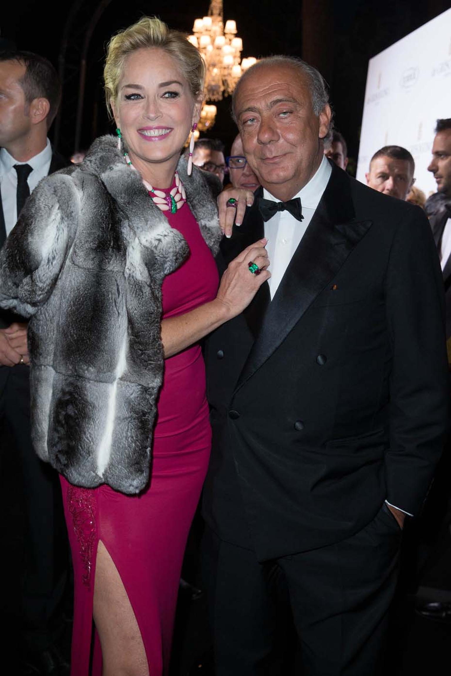 Posing with de GRISOGONO's founder Fawaz Gruosi, Sharon Stone shows off her evening's jewellery choices, which included a three-strand de GRISOGONO coral necklace and matching earrings