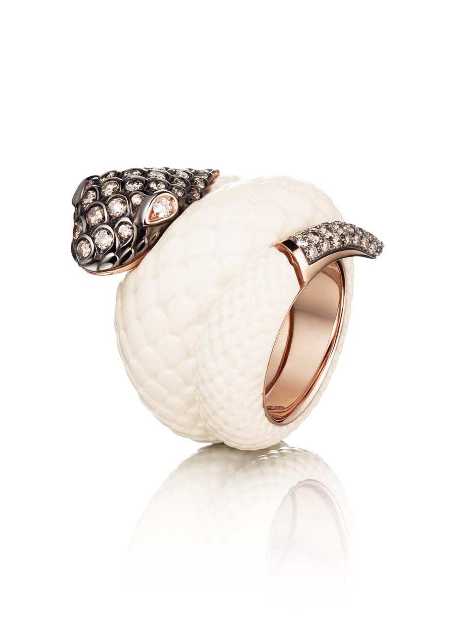 de GRISOGONO pink gold Serpent ring with mammoth tusk for the body and white and brown diamonds for the head and tail as worn by Cara Delevigne.