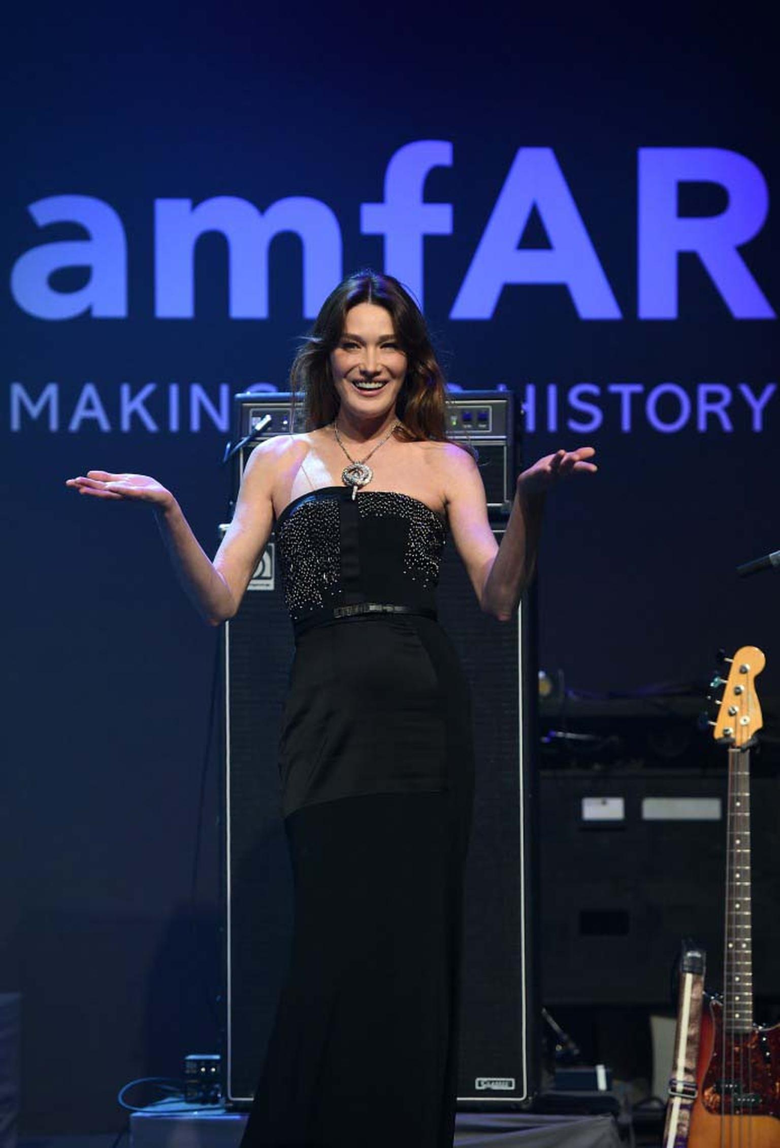 Bulgari ambassador and former first lady of France Carla Bruni-Sarkozy introduces the Bulgari Serpenti necklace that was auctioned for $546,000 during the amfAR Charity Gala in Cannes